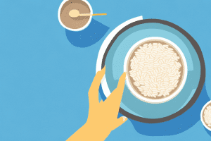 A bowl of rice with a smartphone beside it