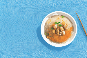 A bowl of thai crab fried rice noodles with both rice vermicelli and rice stick noodles