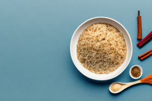 A bowl of traditional tunisian djerbien rice with accompanying spices and herbs