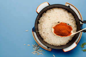 A pot of steaming turkish-style rice with traditional spices and herbs