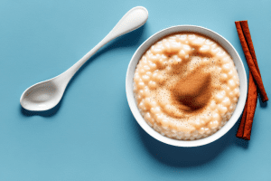 A bowl of creamy rice pudding with a spoon and a sprinkle of cinnamon