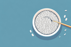 A bowl of jasmine rice with a spoon and a few grains of rice scattered around it