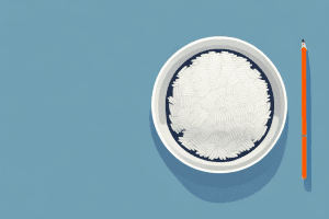 A bowl of cooked rice with a glass of water beside it