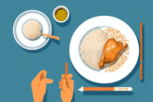 A plate of cooked chicken and rice with a cookeo device in the background